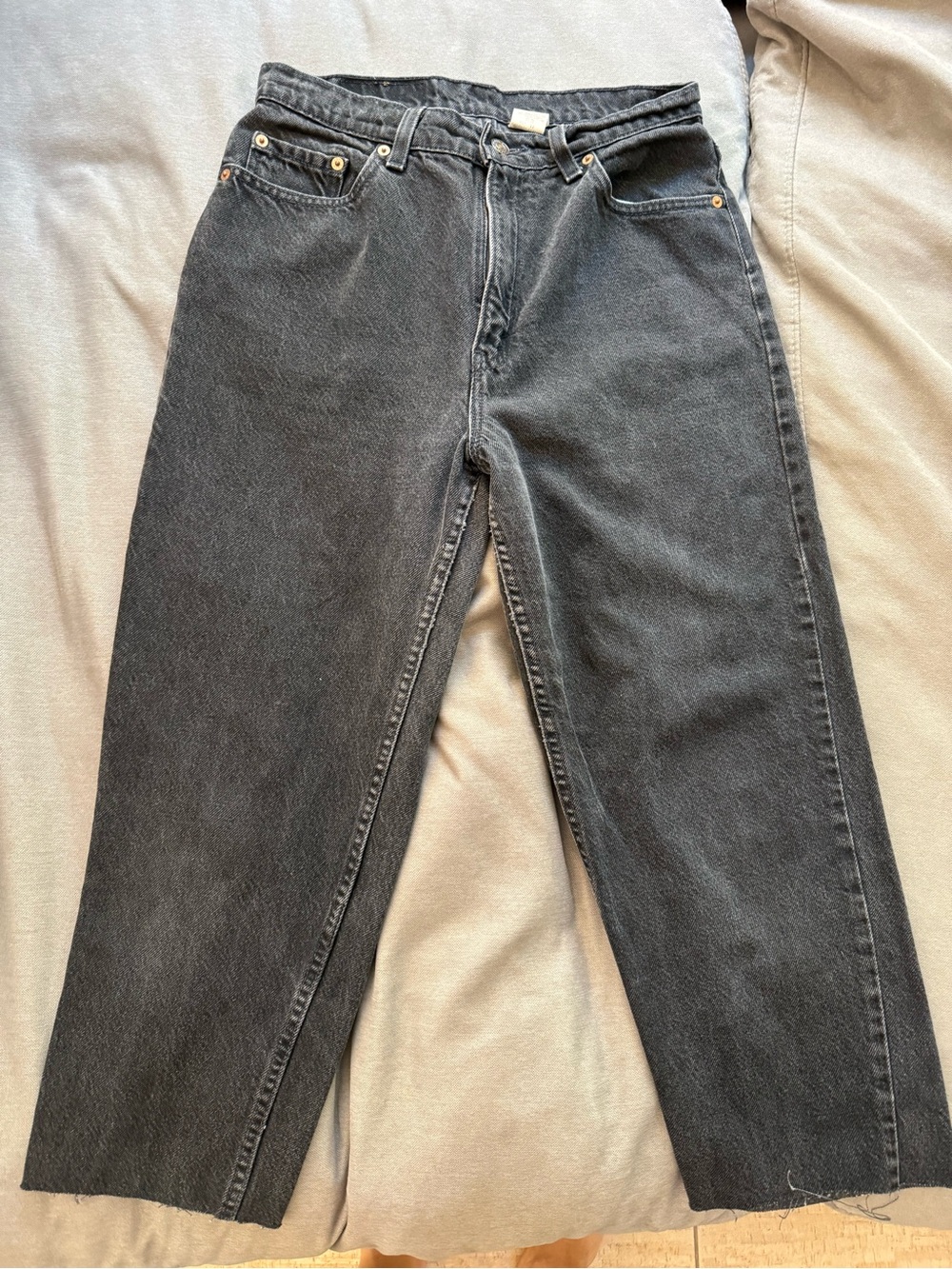 Vintage Levi’s 521 black denim - fits like 27/28. 29” waist, 22” inseam, raw hem